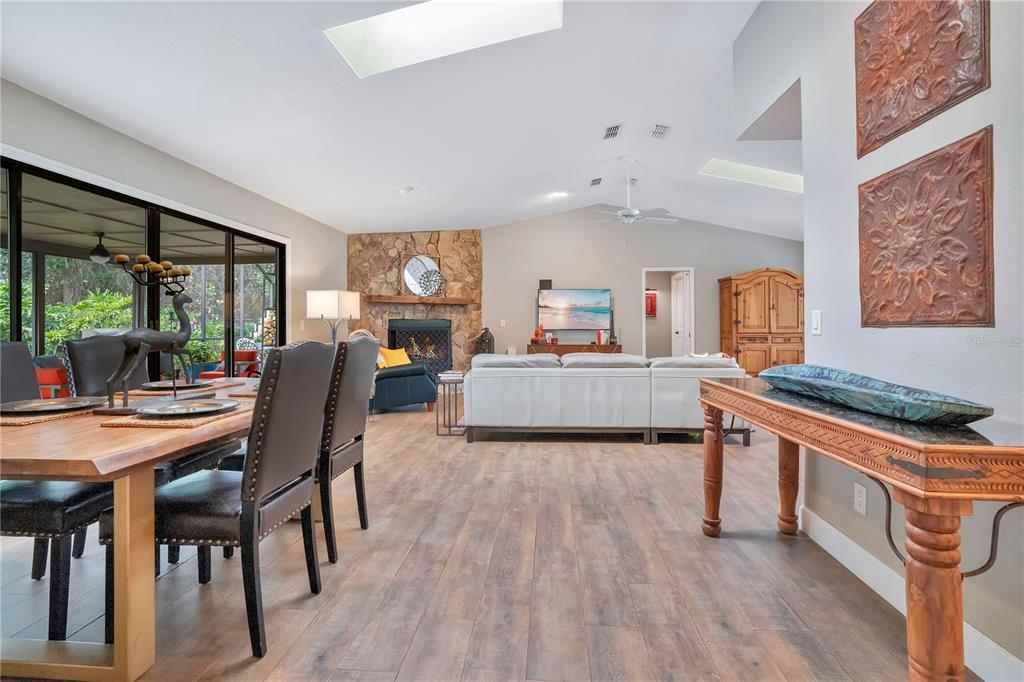 9488 Shortleaf Court Apopka, FL 32703 - Photo 20 of 60 a view of a kitchen with kitchen island dining table and chairs