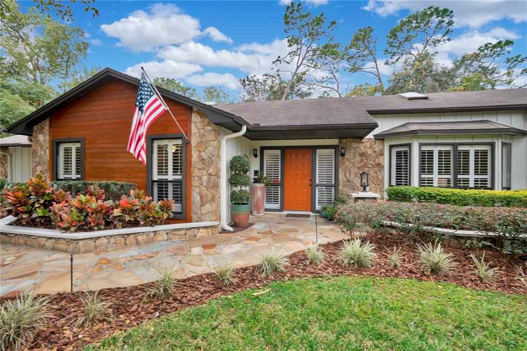 9488 Shortleaf Court Apopka, FL 32703 - Photo 2 of 60 a front view of a house with a porch