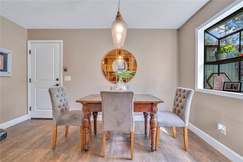 9488 Shortleaf Court Apopka, FL 32703 - Photo 22 of 60 a view of a dining room with furniture and wooden floor