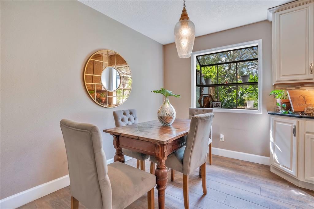 9488 Shortleaf Court Apopka, FL 32703 - Photo 23 of 60 a view of a dining room with furniture window and outside view