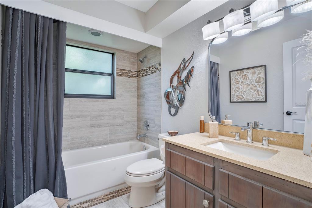 9488 Shortleaf Court Apopka, FL 32703 - Photo 37 of 60 a bathroom with a sink a toilet and a bathtub