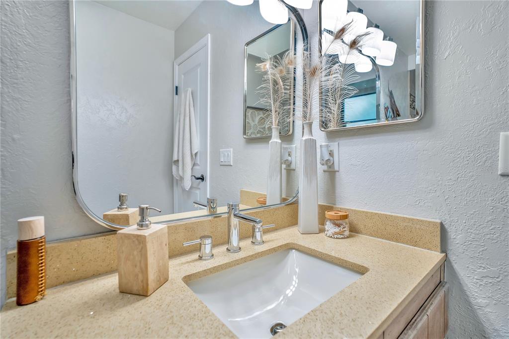 9488 Shortleaf Court Apopka, FL 32703 - Photo 38 of 60 a bathroom with a sink and a mirror