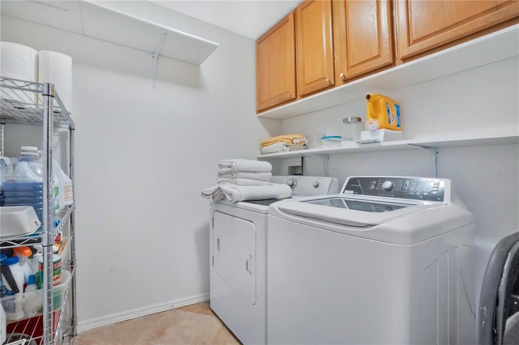 9488 Shortleaf Court Apopka, FL 32703 - Photo 40 of 60 a utility room with dryer and washer