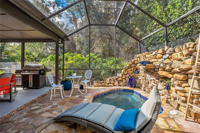 a view of backyard with slide and garden