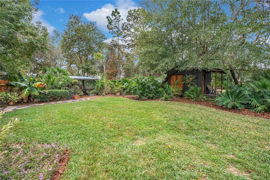 9488 Shortleaf Court Apopka, FL 32703 - Photo 50 of 60 a view of a backyard with a garden