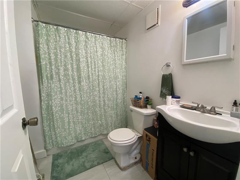 1136 Brownsville Road Pittsburgh, PA 15210 - Photo 13 of 28 a bathroom with a sink toilet and shower