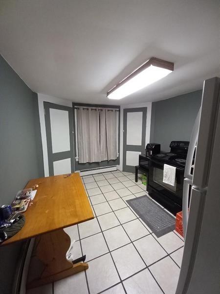 1136 Brownsville Road Pittsburgh, PA 15210 - Photo 14 of 28 a room with gym equipment and wooden floor