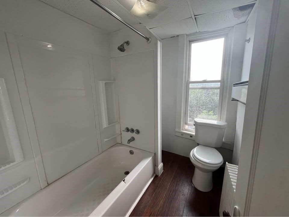 1136 Brownsville Road Pittsburgh, PA 15210 - Photo 22 of 28 a bathroom with a tub and a shower