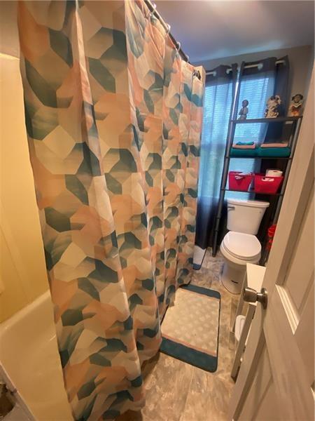 1136 Brownsville Road Pittsburgh, PA 15210 - Photo 27 of 28 a bathroom with a sink toilet and shower