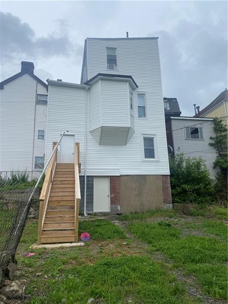 1136 Brownsville Road Pittsburgh, PA 15210 - Photo 28 of 28 a front view of a house with a yard