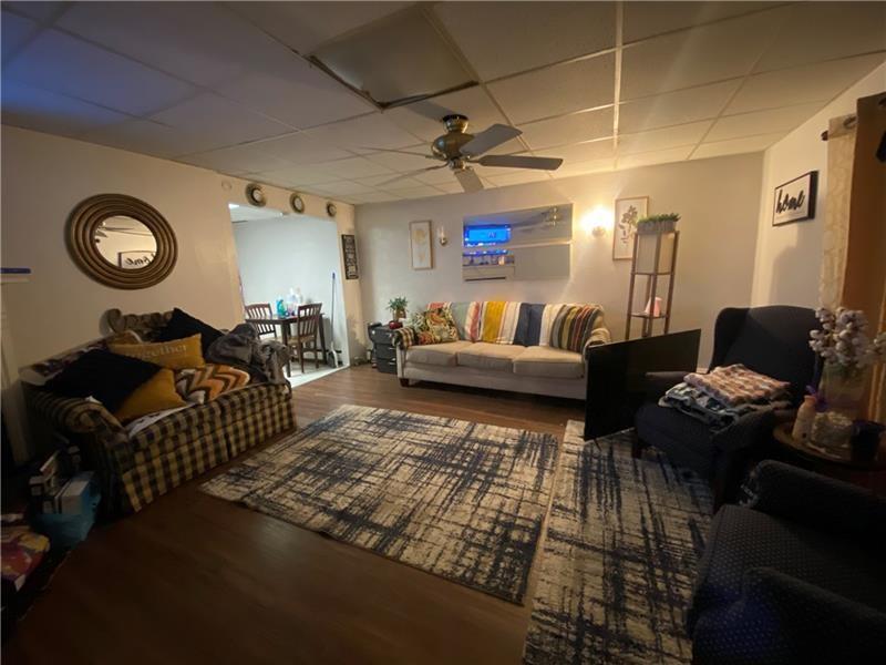 1136 Brownsville Road Pittsburgh, PA 15210 - Photo 9 of 28 a living room with furniture and a table