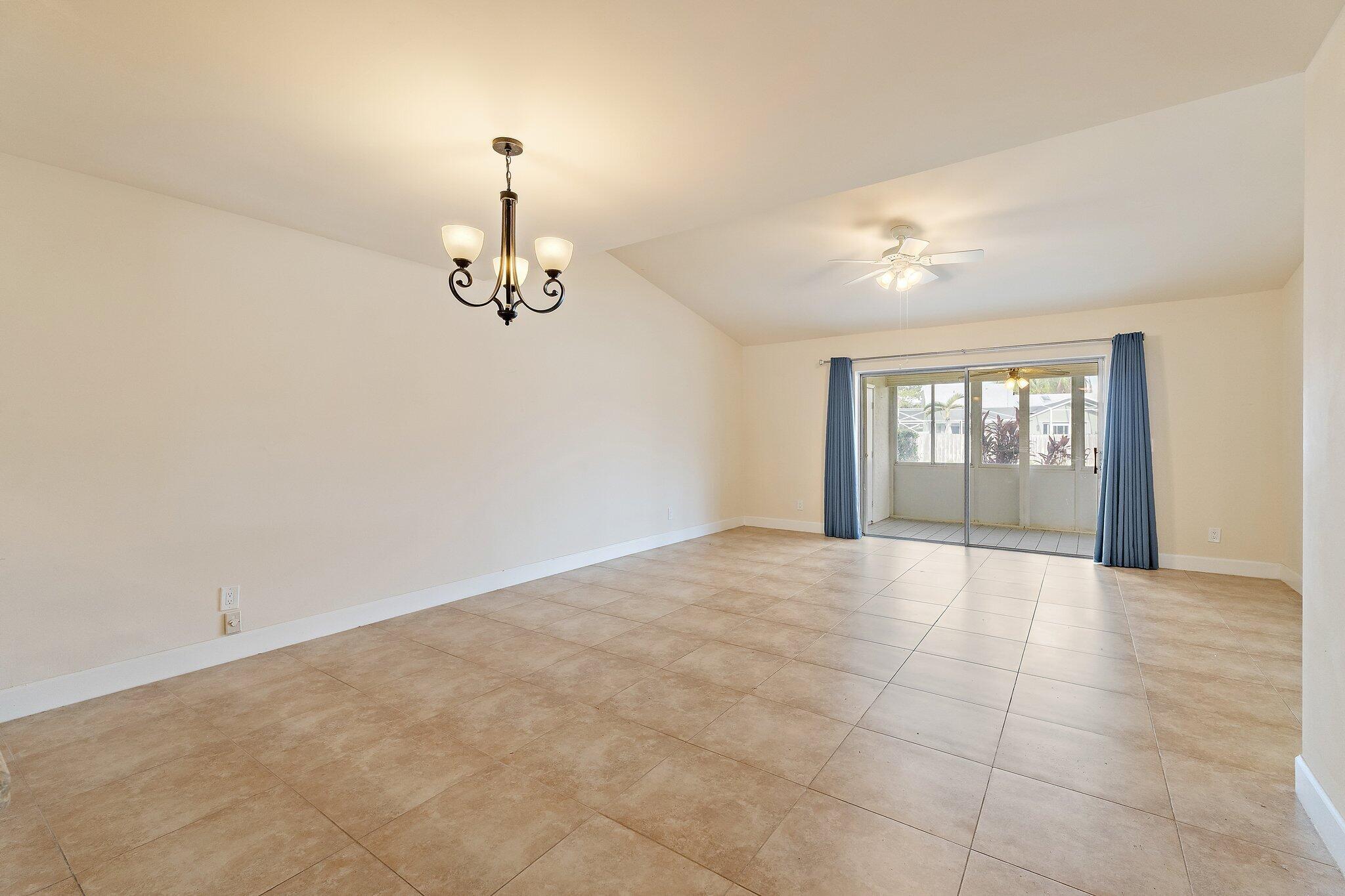 109 Doe Trail Jupiter, FL 33458 - Photo 8 of 26 a view of an empty room with a window
