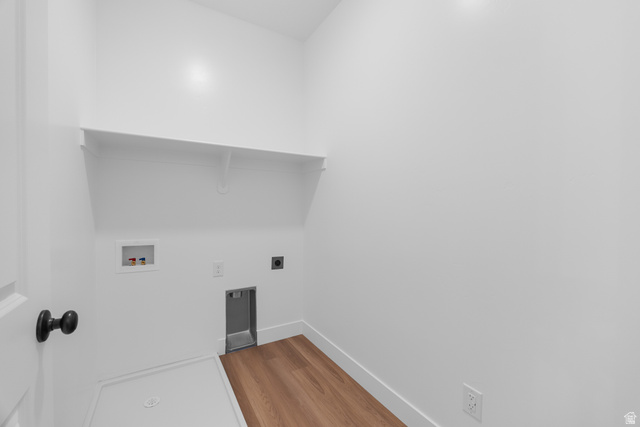 1563 South Deerbrook Road, Unit 267CHM Santaquin, UT 84655 - Photo 13 of 13 Dedicated laundry area featuring white walls, wood-finish flooring, and a built-in white shelf