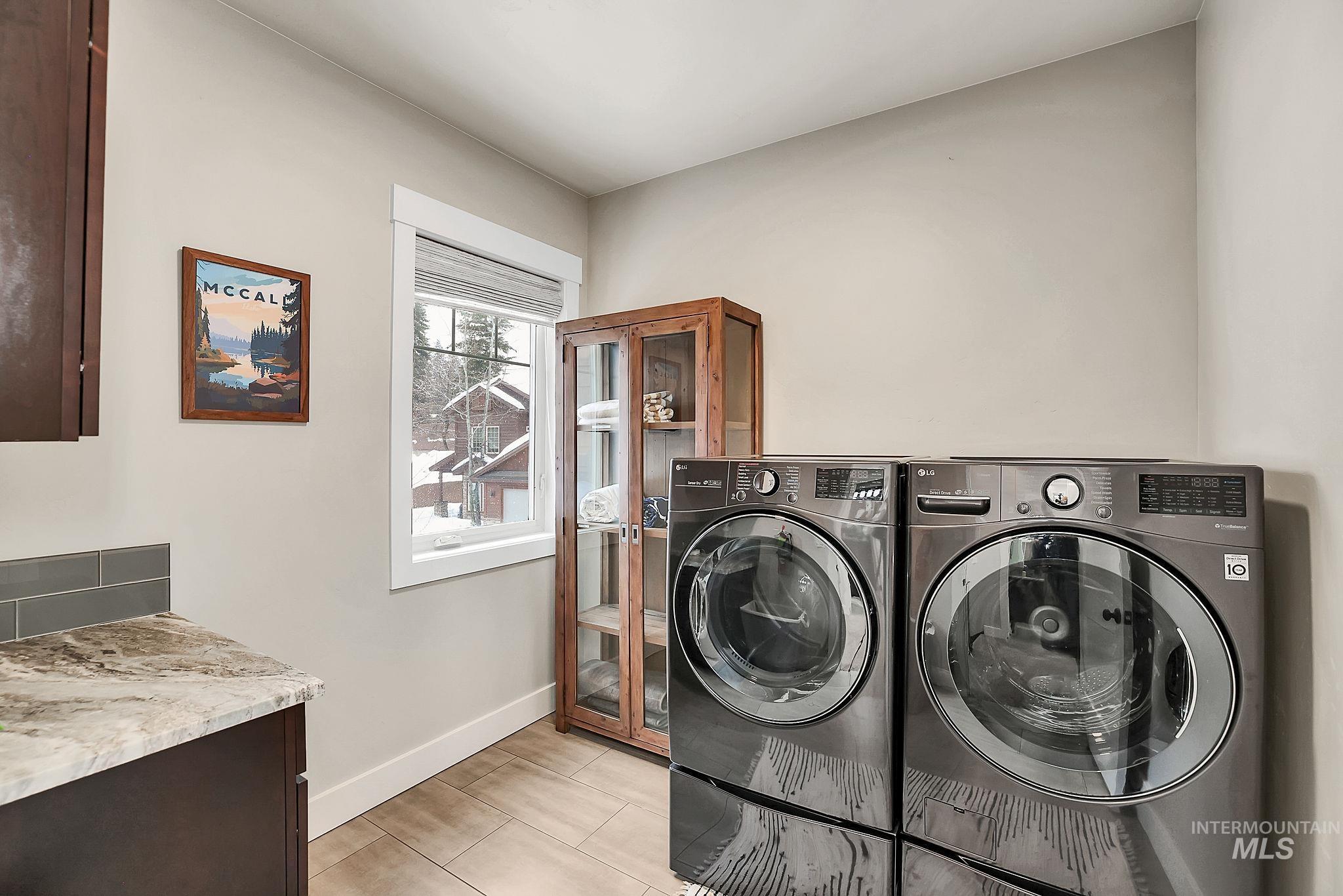 609 Blue Water Circle McCall, ID 83638 - Photo 31 of 45 Laundry room with baseboards and washer and dryer
