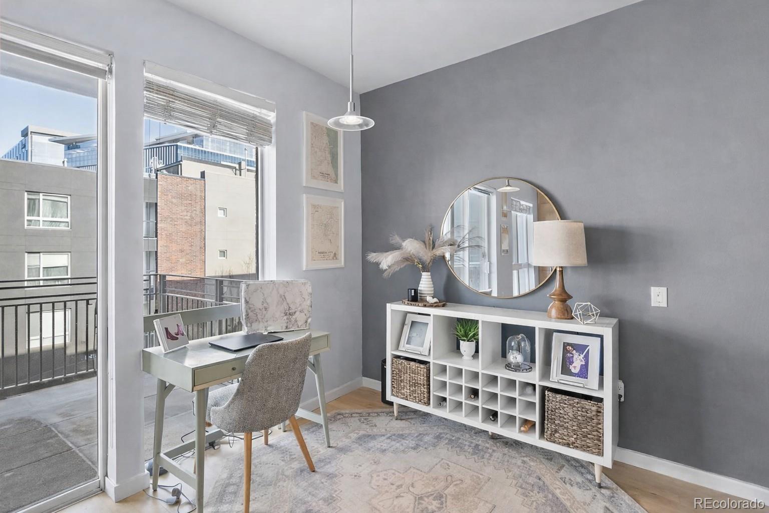 1438 Little Raven Street, Unit 310 Denver, CO 80202 - Photo 8 of 24 a view of a chairs and table in the balcony