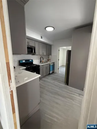 a bathroom with a bathtub and a toilet