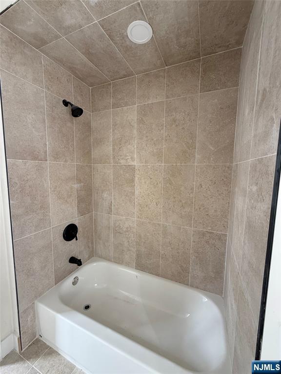 146 Maple Street, Unit 2 Kearny, NJ 07032 - Photo 6 of 12 a bathroom with a bathtub