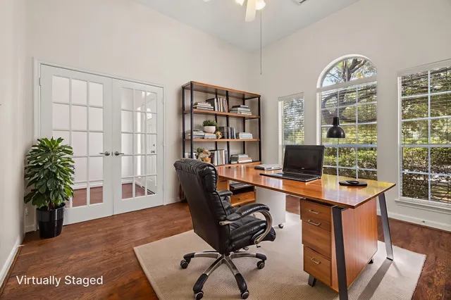 a view of a workspace with furniture and a potted plant
