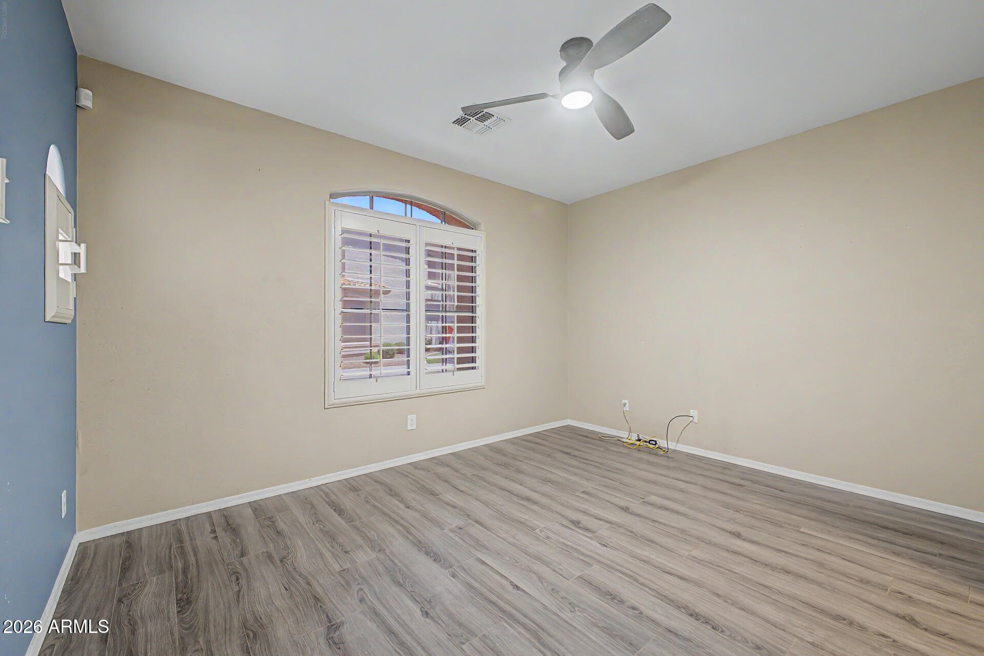 2600 East Springfield Place, Unit 109 Chandler, AZ 85286 - Photo 14 of 38 wooden floor in an empty room with a window