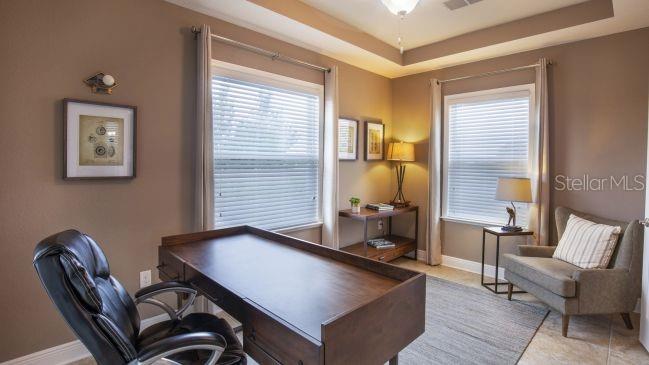 74 Greentree Street Homosassa, FL 34446 - Photo 11 of 21 a room with chairs and a large window