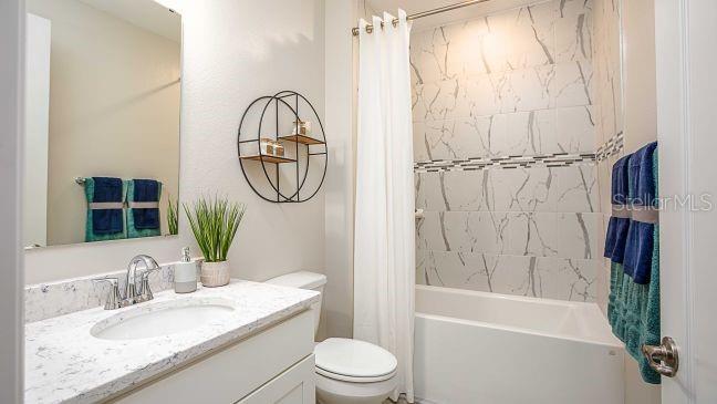 74 Greentree Street Homosassa, FL 34446 - Photo 15 of 21 a bathroom with a granite countertop sink toilet a mirror and shower