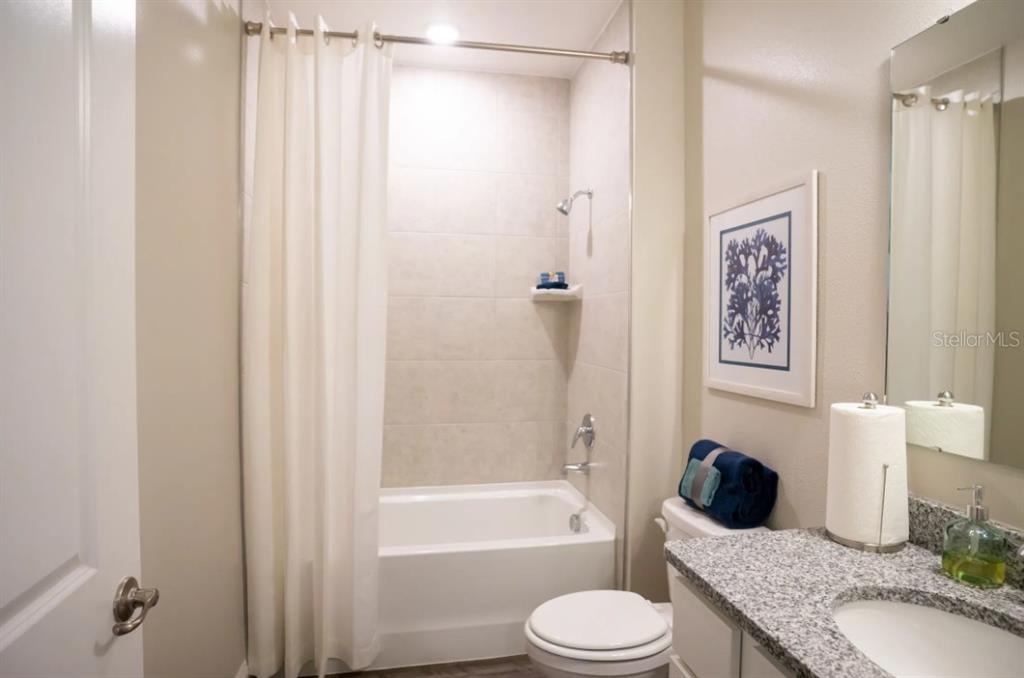 74 Greentree Street Homosassa, FL 34446 - Photo 17 of 21 a bathroom with a granite countertop bathtub shower sink vanity and toilet