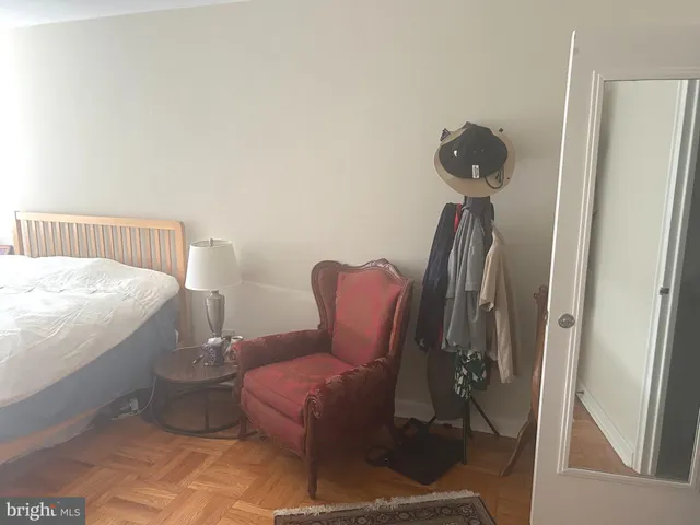 a bathroom with a toilet and a mirror