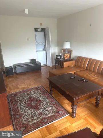 a living room with a couch and rug
