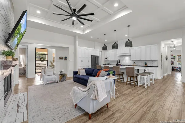 a kitchen with stainless steel appliances a stove a sink dishwasher and a wooden cabinets