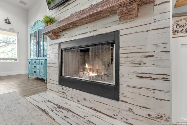 a kitchen with a cabinets and a clock on the wall