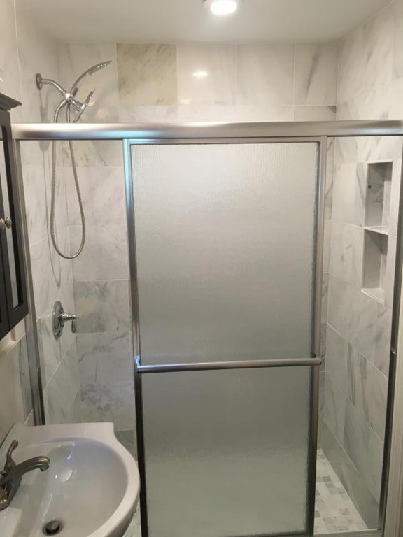 79 Brook Street, Unit 1L Brookline, MA 02445 - Photo 9 of 17 a bathroom with a shower and a sink