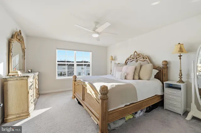 a bed room with a bed and a window