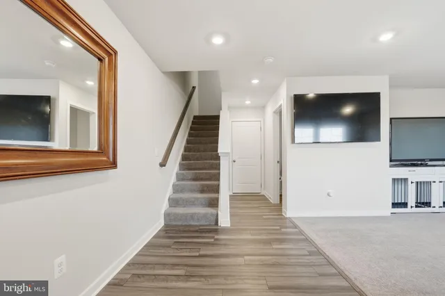 a view of a livingroom with an empty space and a fireplace