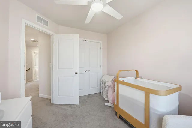 a spacious bathroom with a sink and a mirror