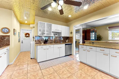 a very nice looking dining room with furniture