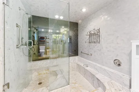 a bedroom with a bed and a couch