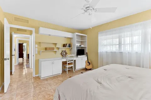 an aerial view of a house with a garden and plants