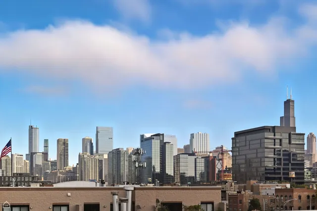 a view of a city with tall buildings in the background