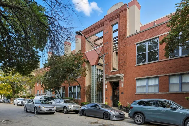a view of a car parked in front of a building