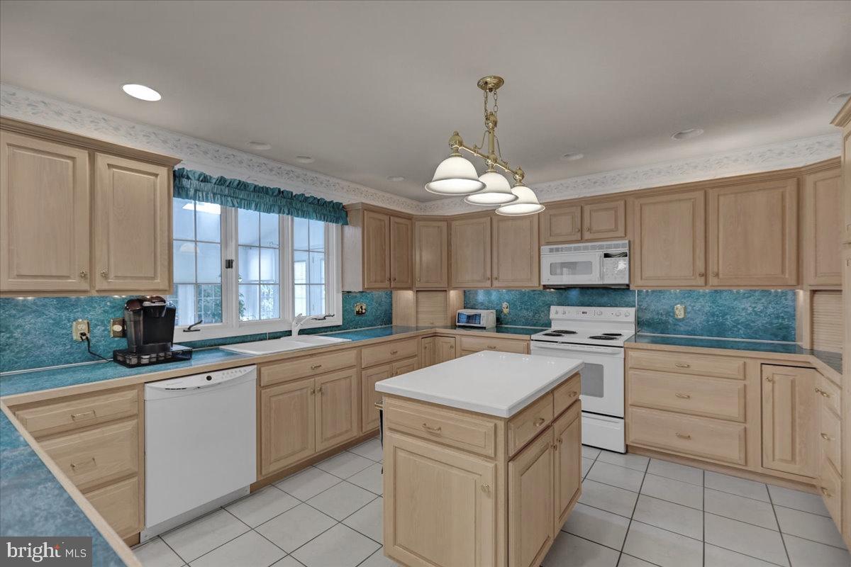 124 Pennsylvania Avenue Sinking Spring, PA 19608 - Photo 14 of 59 Kitchen has triple window looking into sunroom