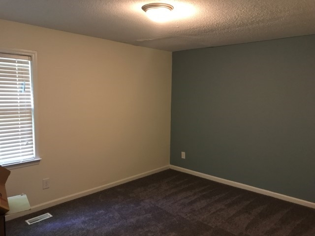 1228 Gorman Street Raleigh, NC 27606 - Photo 10 of 10 an empty room with a workbench