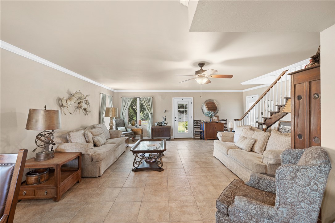 10415 McKnight Road Brenham, TX 77833 - Photo 13 of 23 a living room with furniture and a chandelier