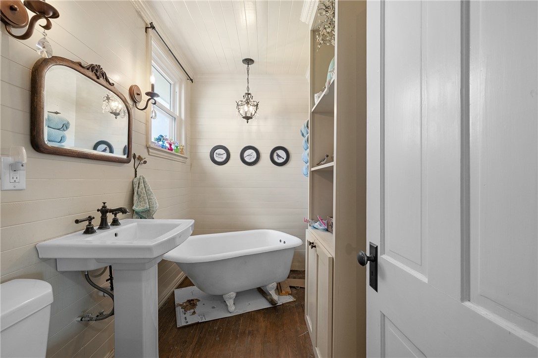 10415 McKnight Road Brenham, TX 77833 - Photo 18 of 23 a bathroom with a sink mirror and toilet