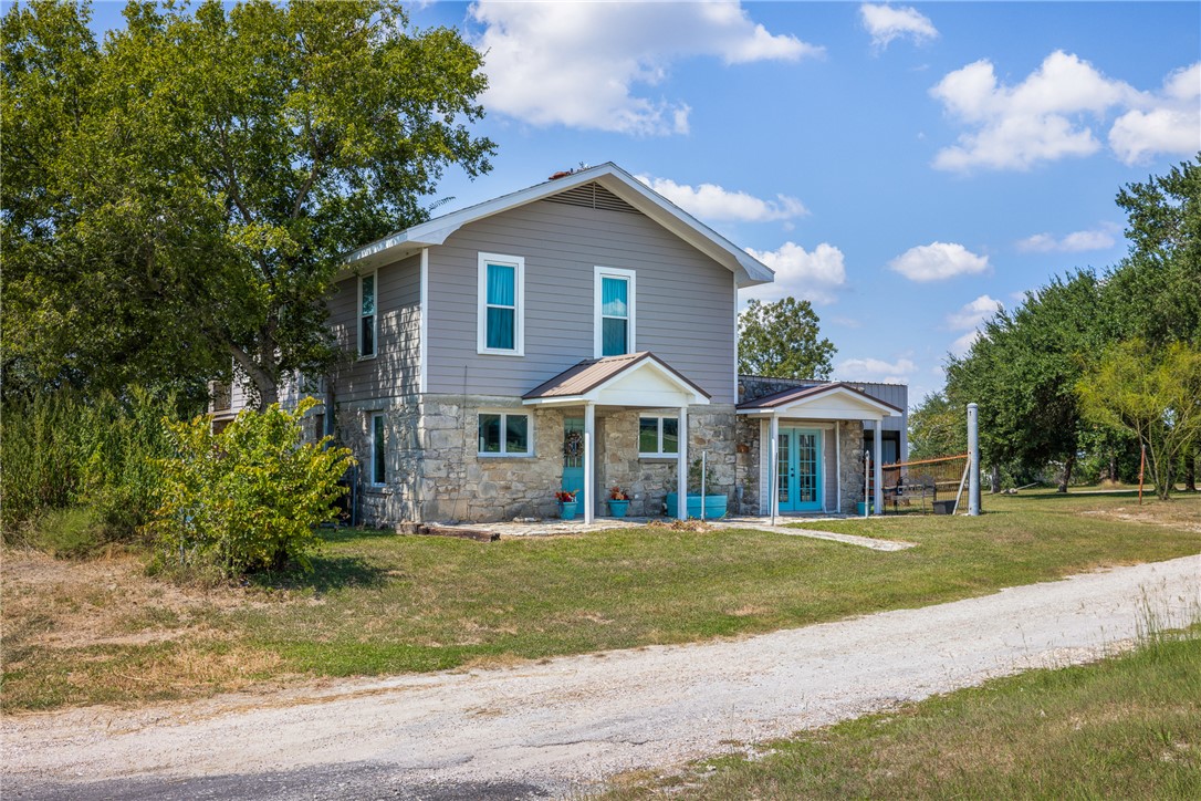 10415 McKnight Road Brenham, TX 77833 - Photo 23 of 23 a front view of a house with a yard