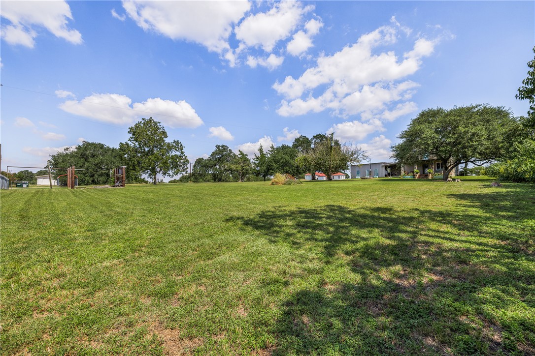 10415 McKnight Road Brenham, TX 77833 - Photo 7 of 23 a view of a golf course with a big yard