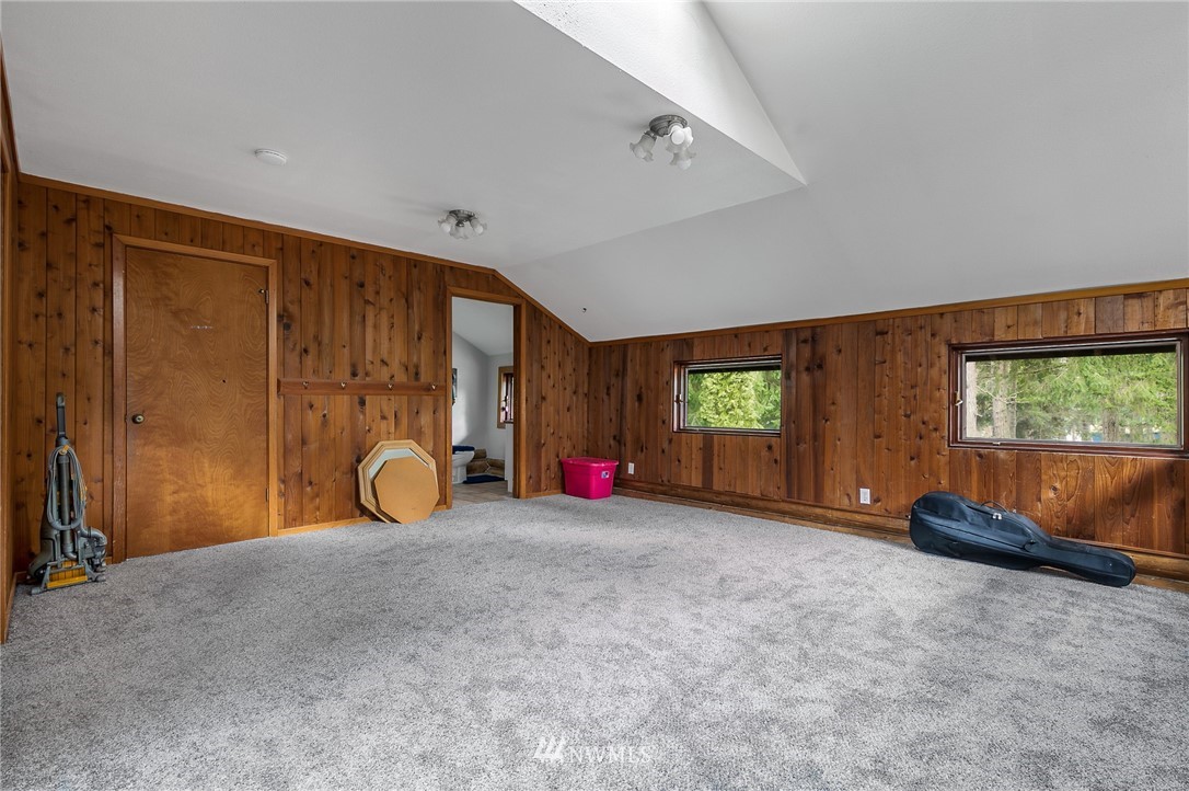 27253 Webster Road East Graham, WA 98338 - Photo 24 of 32 a view of a room with gym equipment and a large window