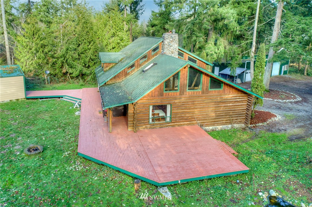 27253 Webster Road East Graham, WA 98338 - Photo 4 of 32 a view of an house with backyard space and garden