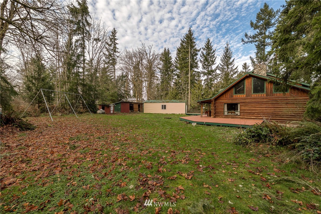 27253 Webster Road East Graham, WA 98338 - Photo 31 of 32 a front view of house with yard and green space