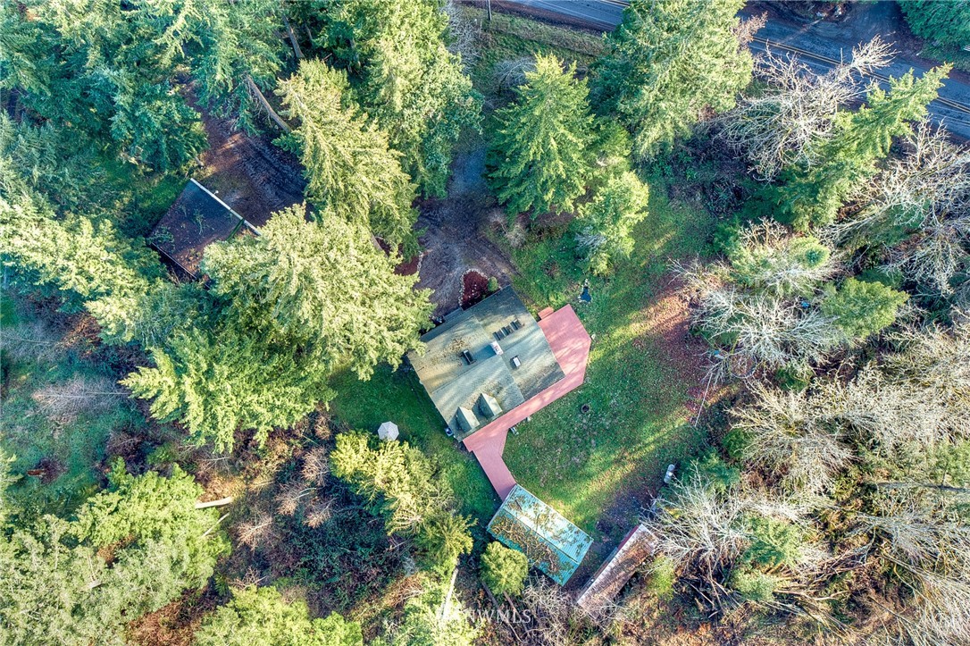 27253 Webster Road East Graham, WA 98338 - Photo 32 of 32 an aerial view of a house with a yard and garden