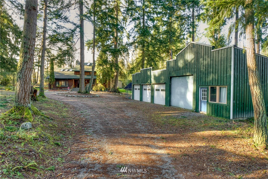 27253 Webster Road East Graham, WA 98338 - Photo 7 of 32 a view of a house with a tree in front